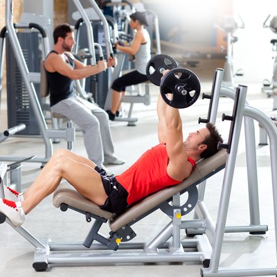 group with weight training equipment on sport gym