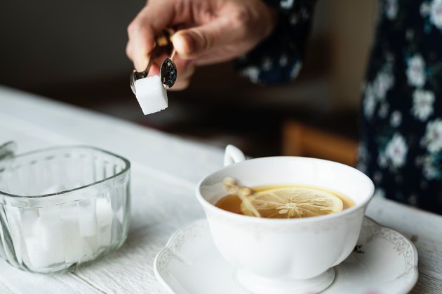 Sugar cube tea cup on table