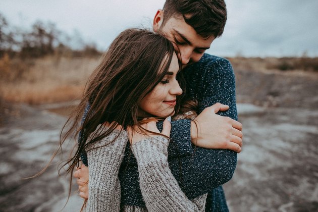 couple cuddling in nature