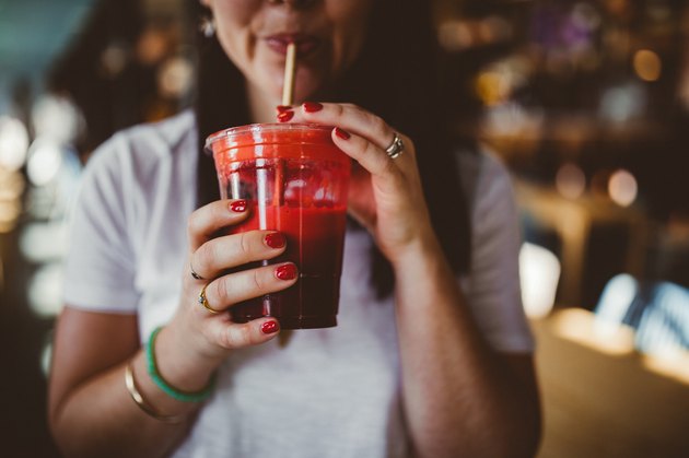 Girl drinking pomegranate juice