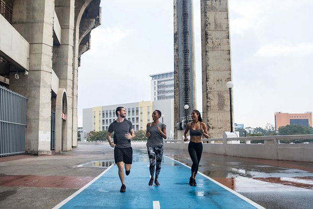 friends running on a paved road