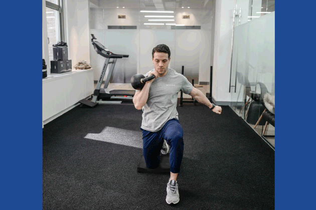 Sam Becourtney Performing Half-Kneeling Single-Arm Kettlebell Press