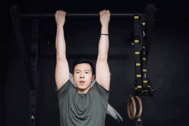 Matt Cheng performing chin-ups.