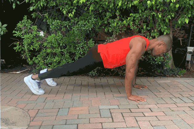 Man demonstrating how to do a Push-Up With Arm Extension
