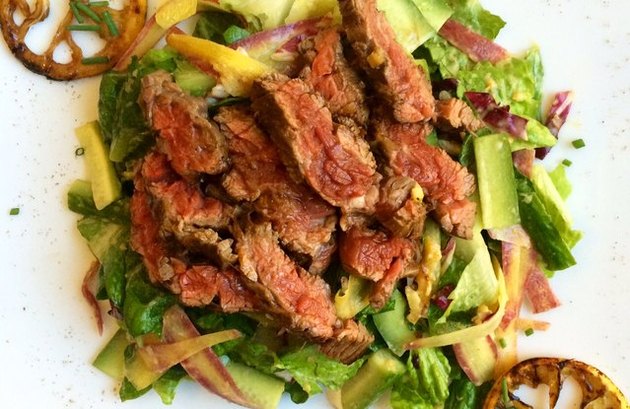 paleo salad with charred lemon and skirt steak