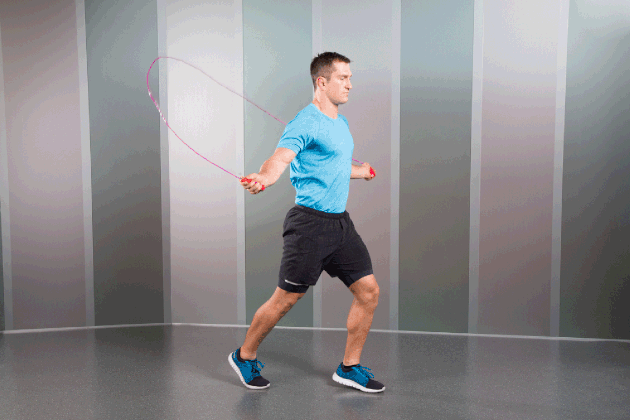 Man Demonstrating How to Do Scissor Jumps