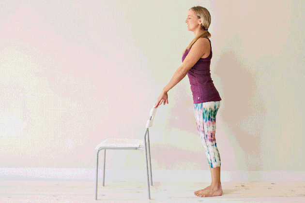 Woman demonstrating how to do parallel plie pulses for an at-home barre workout