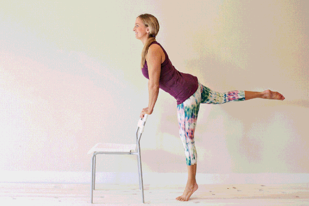 Woman demonstrating how to do arabesques and attitudes for an at-home barre workout