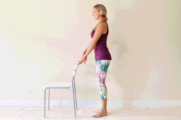 Woman demonstrating how to do small vs for an at-home barre workout