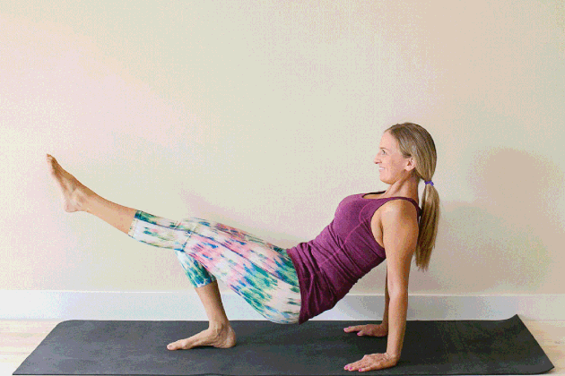 Woman demonstrating how to do triceps dips for an at-home barre workout
