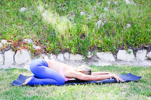 woman doing Child’s pose (Balasana)