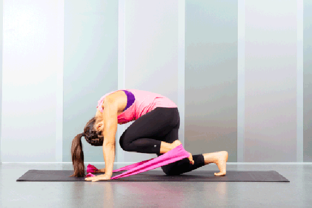 Proper form for resistance band glute kickback with ab pull-in