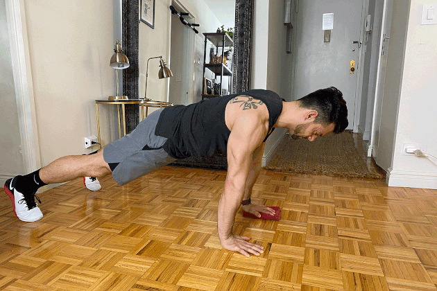 Proper form for towel push-up with arm reach.