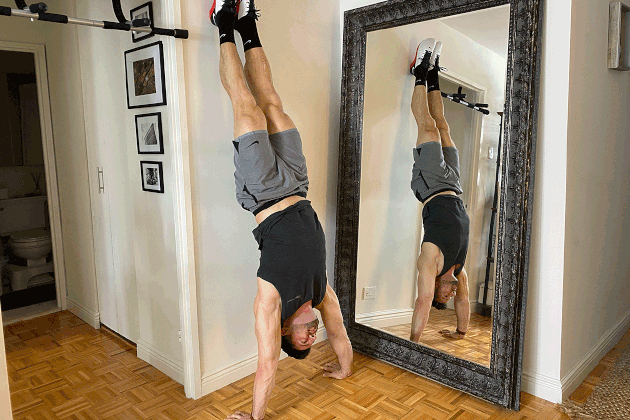 Proper form for handstand push-ups.