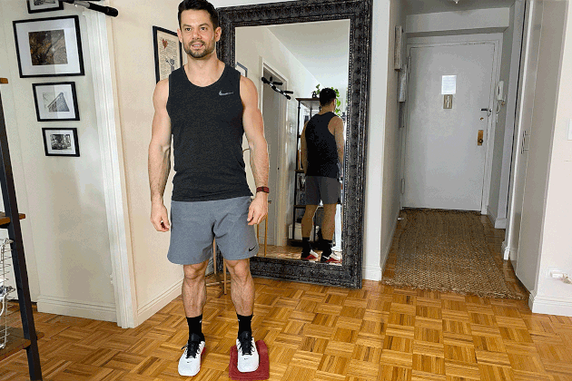 Proper form for towel lateral lunge.