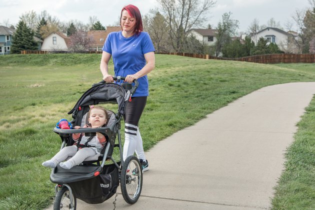 Alanna pushes her daughter in a stroller