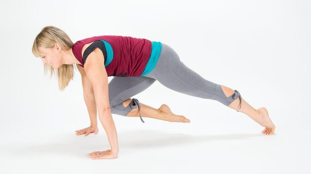 Elise Joan demonstrates how to do a bicycle plank