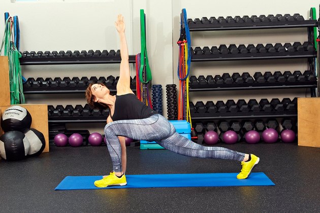 Woman demonstrating how to do a high-lunge with core rotation