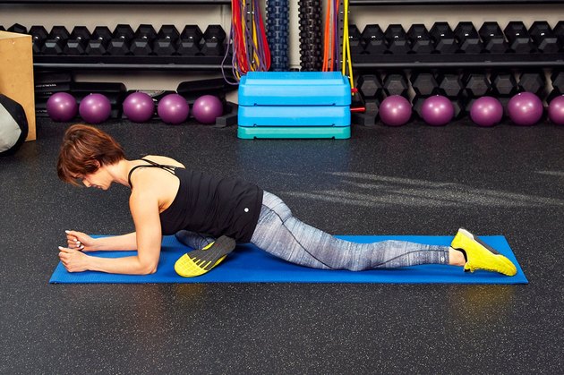Woman demonstrating how to do Pigeon pose