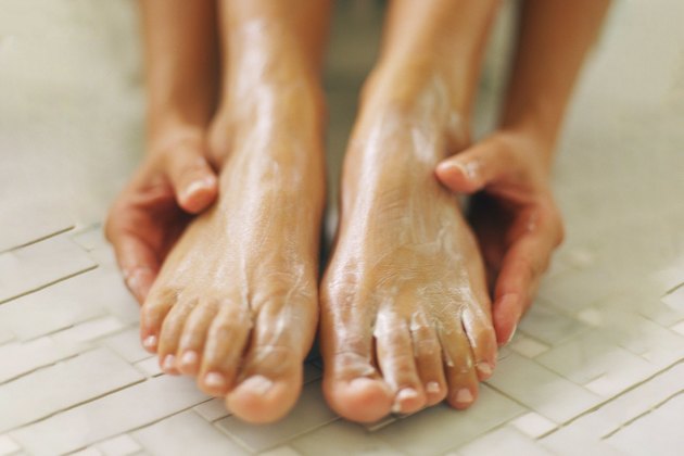 Womans feet being treated.