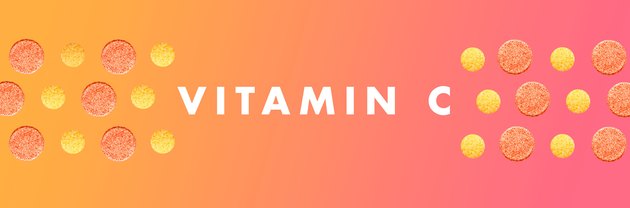 Vitamin C tablets in a pattern on a pink and orange background