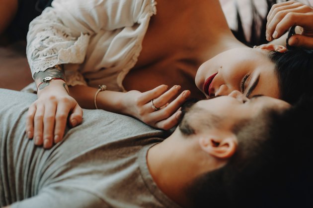 couple holding each other in bed