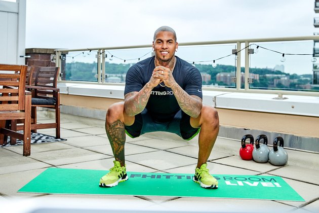 Fhitting Room trainer demonstrating how to do a sumo squat