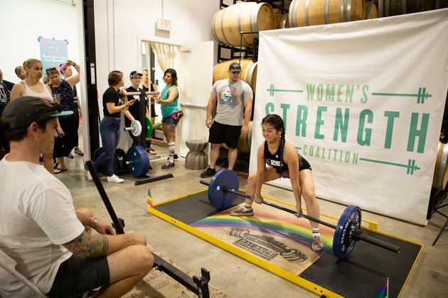 woman deadlifting weight for charity event for Women’s Strength Coalition