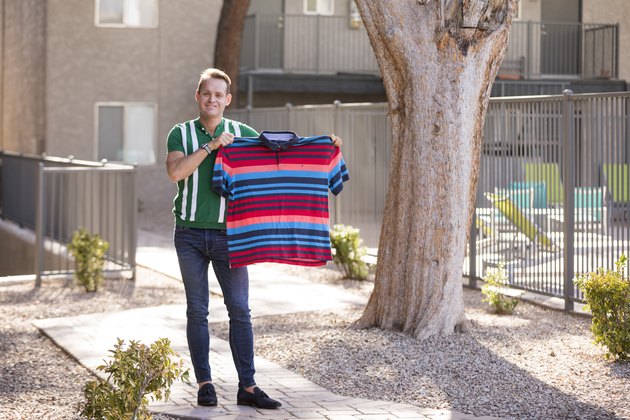 Pierre holds one of his old shirts