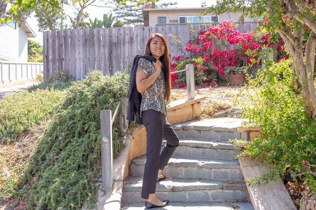 Kristina poses on outdoor steps