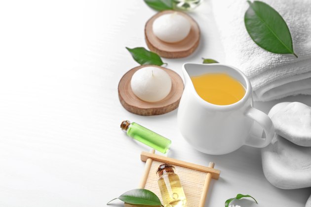 Spa composition with tea tree oil on white background
