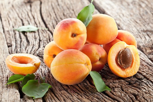 Apricots with leaves.