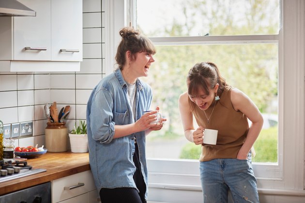 Friends chatting in kitchen