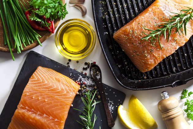 Raw salmon steak and herbs