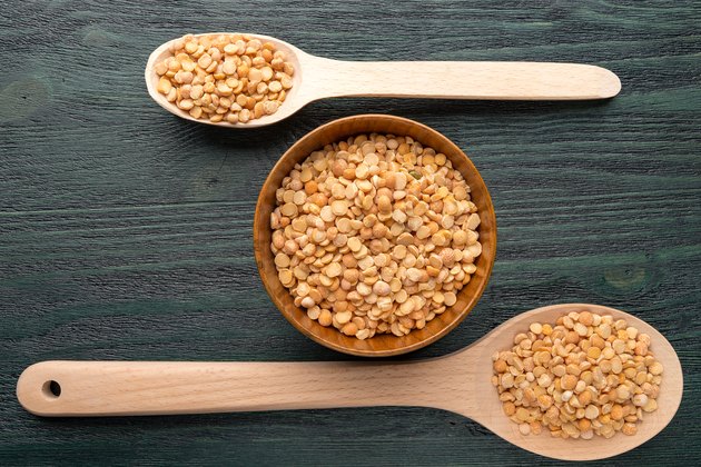 Wooden spoons and bowls with split peas