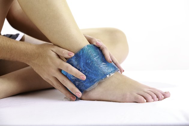Woman with gel pack on ankle