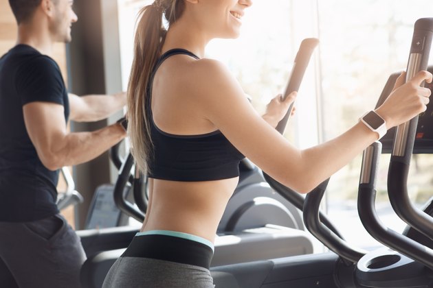 Young couple exercise together in gym healthy lifestyle