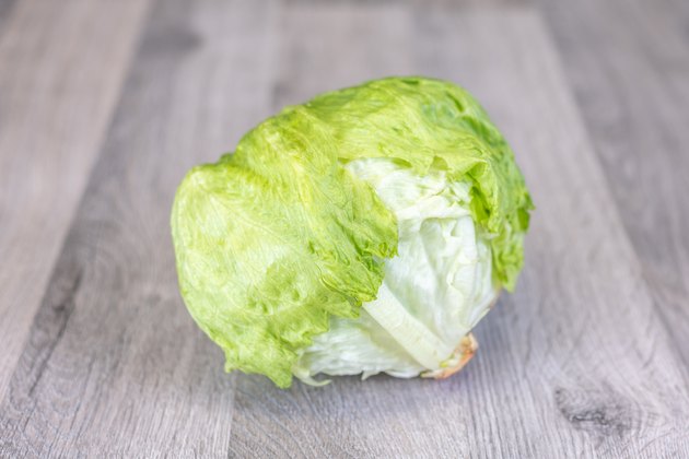 Iceberg lettuce on a wooden table