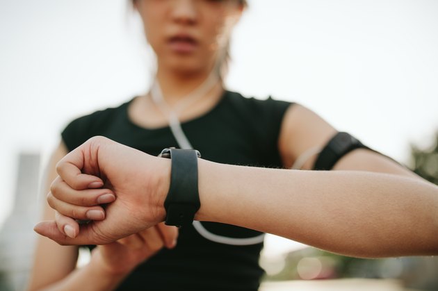 A woman monitoring her performance on a smartwatch