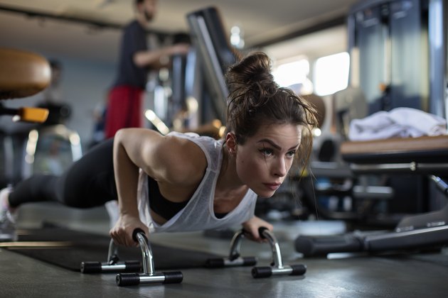 Cute brunette working out at a gym