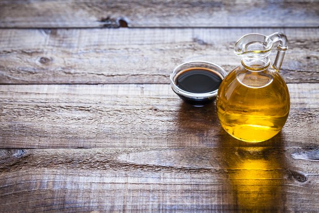 Oil and vinegar on rustic wooden table