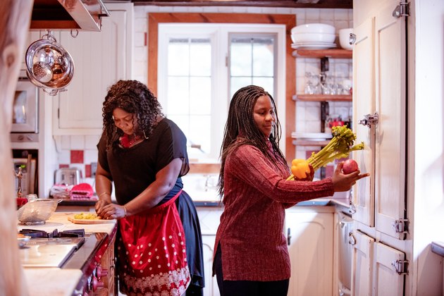 Thanksgiving dinner with American-African family preparing dinner