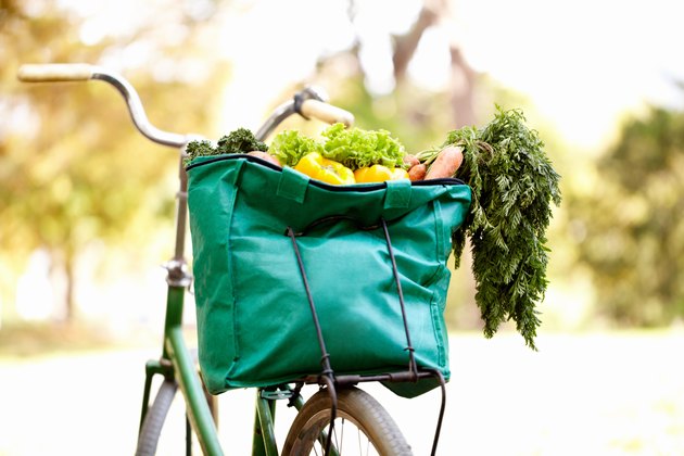 green bike bag filled with healthy groceries