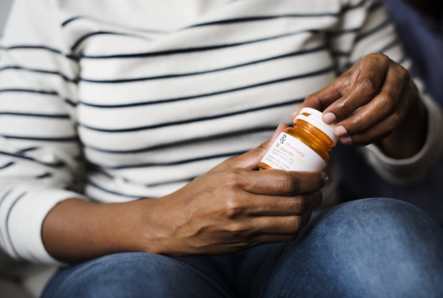 Woman taking pills for her health