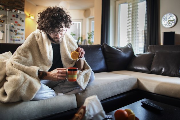 Sick At Home . Man having a cup of tea