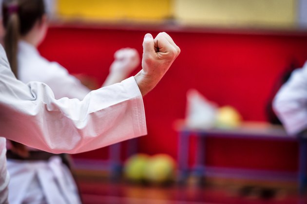 Unrecognizable couple during kung fu training event