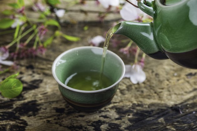 Pouring Green Tea in cup