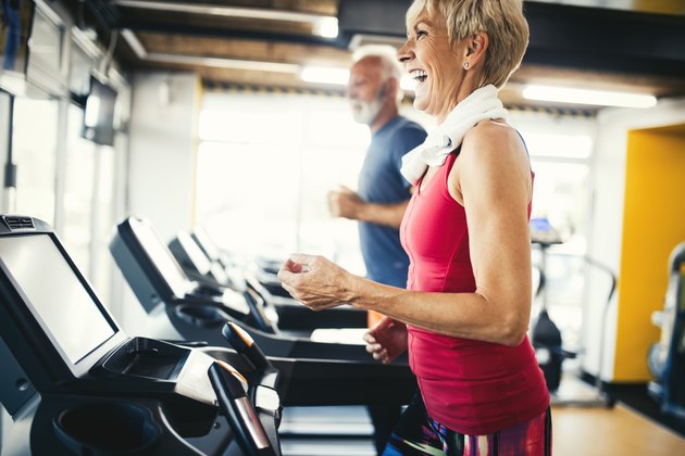 Senior people walking on the treadmill at fitness gym club for 40 minutes