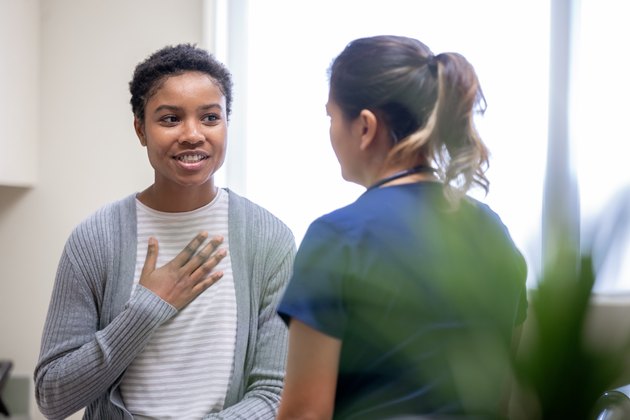 Nurse explaining good news to female patient discussing Low Blood Sodium Levels and hyponatremia