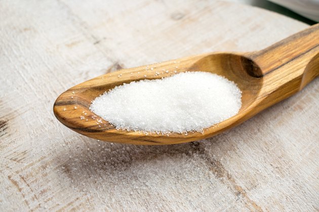 Artificial Sweeteners and Sugar Substitutes in wooden spoon. Natural and synthetic sugarfree food additive: sorbitol, fructose, honey, Sucralose, Aspartame